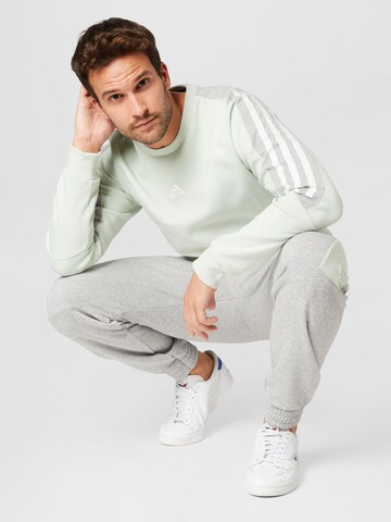 ADIDAS SPORTSWEAR - Sweatshirt de desporto 'Future Icons 3-Stripes' em verde