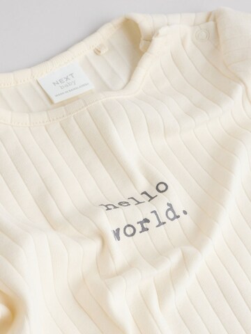 Set de la Next pe bej