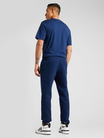 ADIDAS ORIGINALS Alt kitsenev Püksid 'Trefoil Essential', värv sinine