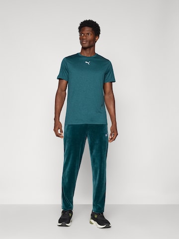 PUMA Regular Broek 'ESS' in Groen