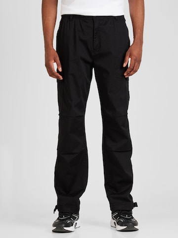 Loosefit Pantaloni cu buzunare de la Calvin Klein Jeans pe negru: față