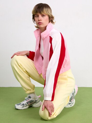 Nike Sportswear Tapered Pants 'PHNX FLC' in Yellow