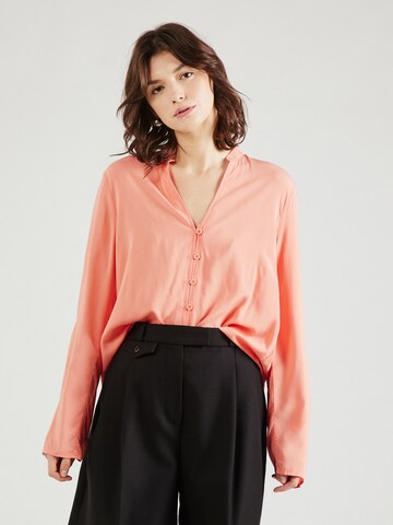 QS Blus i orange: framsida