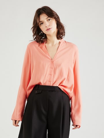 QS Blus i orange: framsida