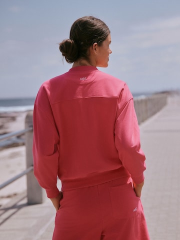 Sweat-shirt self. en rose
