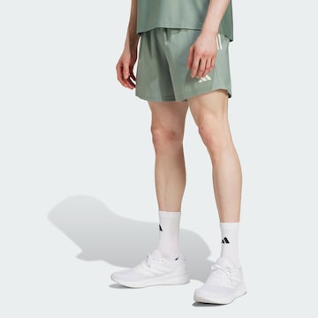 regular Pantaloni sportivi 'Own The Run' di ADIDAS PERFORMANCE in verde: frontale