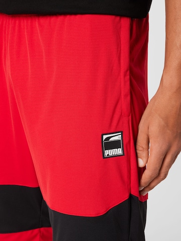 PUMA Loose fit Sports trousers in Red