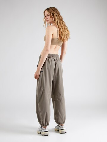 Effilé Pantalon de sport 'Unstoppable' UNDER ARMOUR en marron