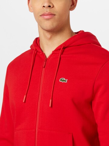 Veste de survêtement LACOSTE en rouge