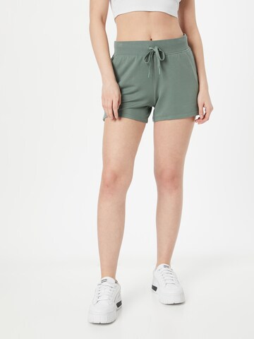 Regular Pantalon de sport SKECHERS en vert : devant
