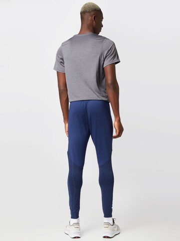 NIKE Skinny Workout Pants in Blue