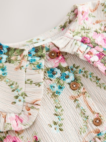 Rochie de la Next pe bej