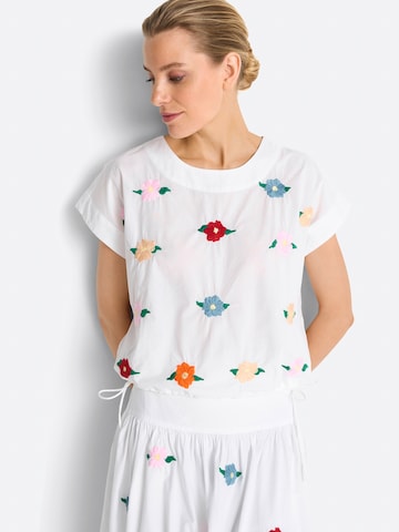 Rich & Royal Blus i vit: framsida