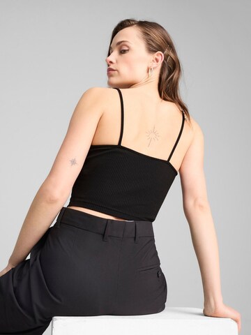 Top 'Puma Wardrobe Ess Ribbed Tank Top' di PUMA in nero