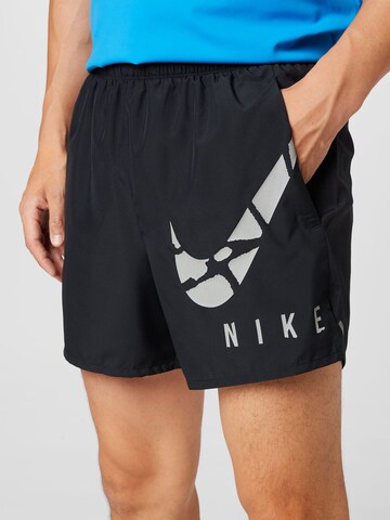 NIKE Regular Sports trousers in Black