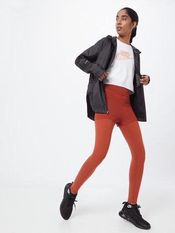 Skinny Pantalon de sport NIKE en orange