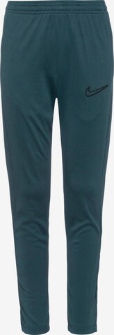 NIKE Workout Pants in Green: front