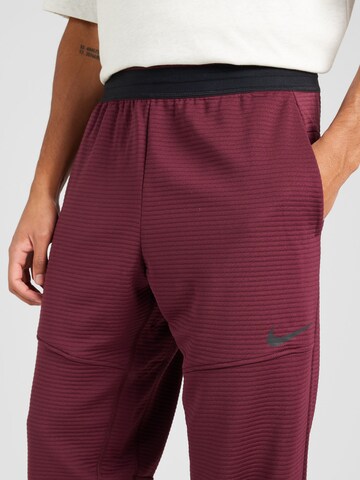 NIKE Regular Workout Pants 'Pro' in Red