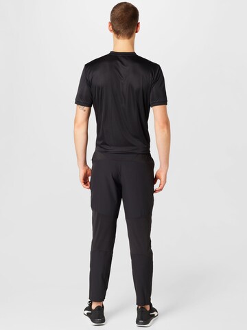 PUMA Zwężany krój Spodnie sportowe 'Ultraweave' w kolorze czarny