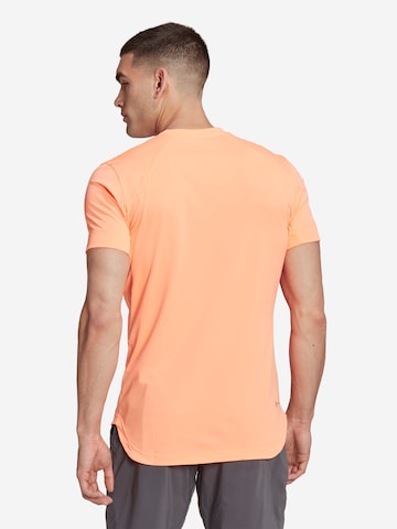 ADIDAS SPORTSWEAR - Camisa funcionais 'New York Freelift' em laranja