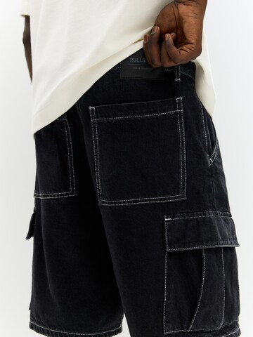 Pull&Bear Loosefit Cargojeans i svart