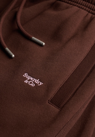 Superdry & Co Zúžený strih Nohavice 'Signature' - Hnedá