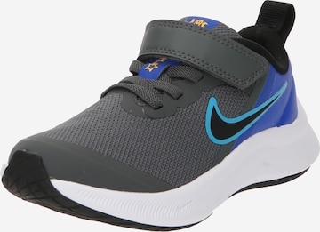 Chaussure de sport NIKE en gris : devant