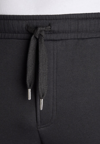 JOHN DEVIN Regular Trousers in Black