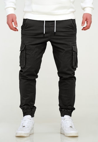 behype Regular Cargo Pants in Black: front