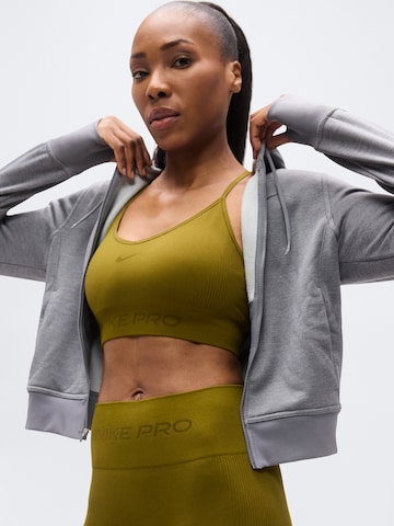 NIKE - Soutien Bustier Soutien de desporto em verde