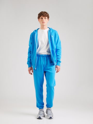 Effilé Pantalon 'Club' Nike Sportswear en bleu