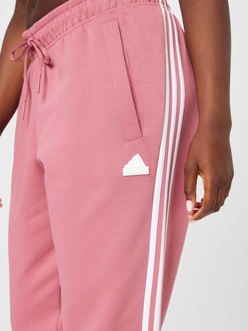 rožinė ADIDAS SPORTSWEAR Siaurėjantis Sportinės kelnės 'Future Icons 3-Stripes  '