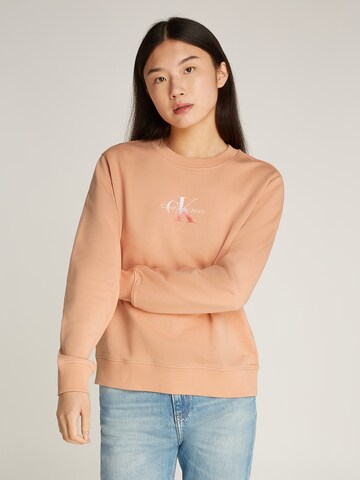 Felpa di Calvin Klein Jeans in arancione: frontale