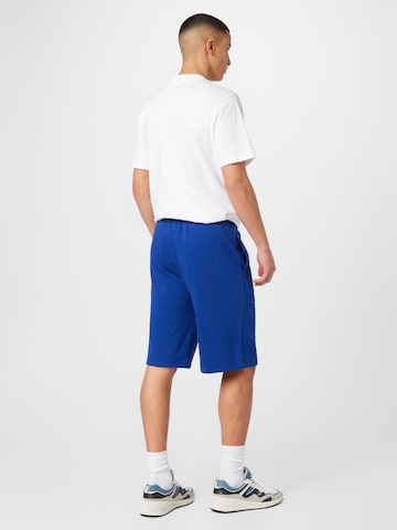 Loosefit Pantaloni di Champion Authentic Athletic Apparel in blu