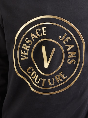 Bluză de molton de la Versace Jeans Couture pe negru