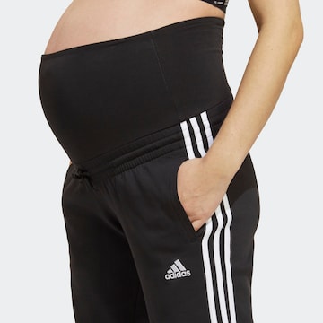 ADIDAS SPORTSWEAR Tapered Urheiluhousut värissä musta