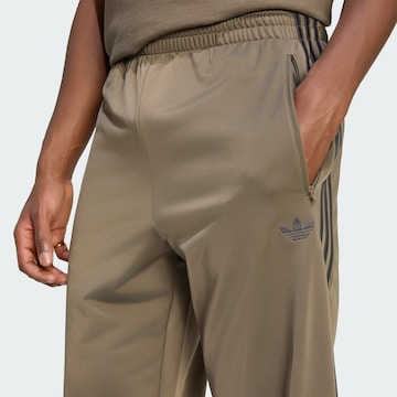 regular Pantaloni 'Firebird' di ADIDAS ORIGINALS in marrone