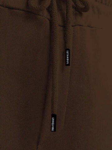 UNIQVIBE Tapered Trousers in Brown