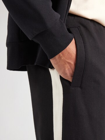Loosefit Pantaloni di TOPMAN in nero