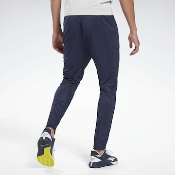 Effilé Pantalon de sport Reebok en bleu