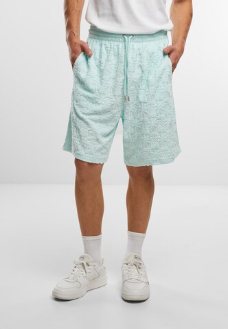 Loosefit Pantalon Karl Kani en vert : devant
