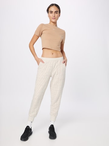 Effilé Pantalon de sport NIKE en blanc