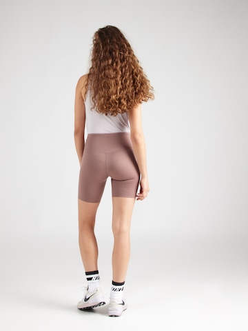 Skinny Pantalon de sport 'GO' NIKE en violet