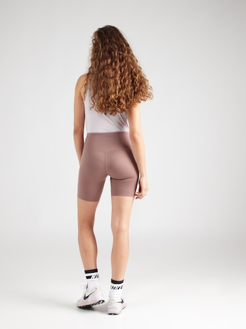 NIKE Skinny Sportsbukser 'GO' i lilla