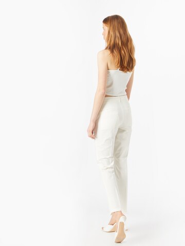 Coupe slim Pantalon chino TOMMY HILFIGER en blanc