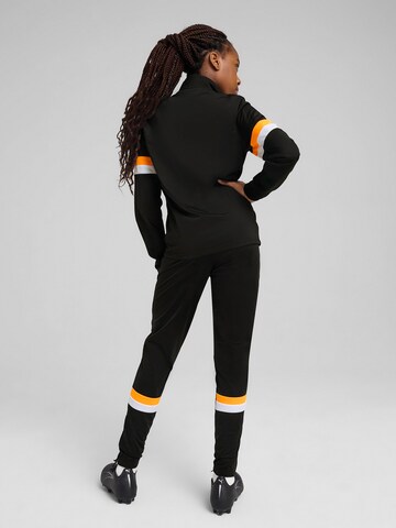 Completo per l'allenamento 'Individual Rise' di PUMA in nero