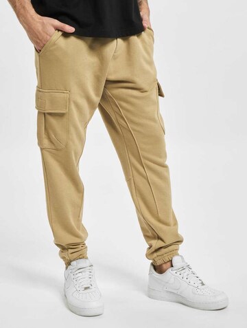 Tapered Pantaloni cargo 'Ozan' di Urban Classics in beige: frontale