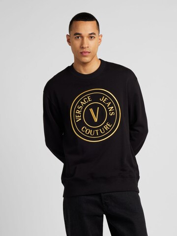 Versace Jeans CoutureSweater majica '76UP306' - crna boja: prednji dio