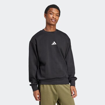 ADIDAS SPORTSWEAR Sportsweatshirt 'FEELCOZY' in Schwarz