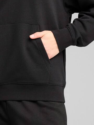 PUMA Sports sweatshirt 'Ess' in Black